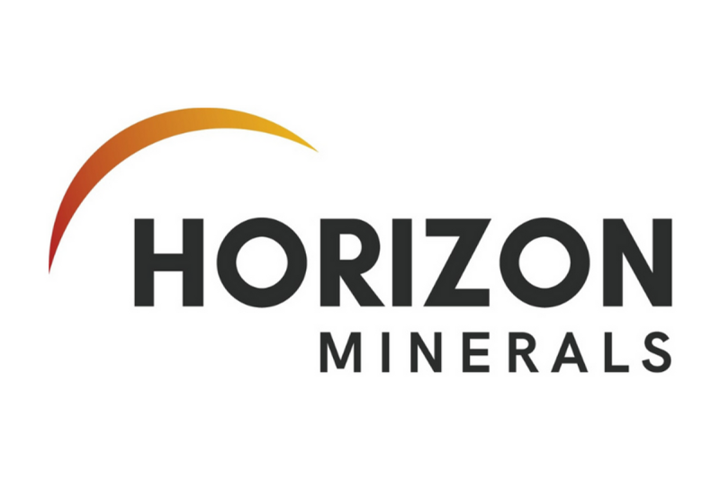 Investor Insight                                
Horizon Minerals’ near-term cash-flow potential, large-scale gold resource base, and strategic processing infrastructure in the prolific Western Australian Goldfields position the company to transition into a sustainable, standalone mid-tier gold producer. Recent acquisitions, operational start-ups and high-grade resource expansions strengthen Horizon’s ability to leverage record gold prices and deliver consistent shareholder returns.
                            Overview                                
Horizon Minerals (ASX:HRZ,OTC:HRZMF) is an emerging standalone gold producer strategically positioned in the heart of Western Australia’s world-class goldfields. The company has built a robust portfolio of high-quality gold projects complemented by significant base and precious metal resources, all within easy haulage distance of key processing infrastructure. 
<em><em>Horizon currently holds 1.8 Moz of resources across 1,386 sq km of exploration tenure.</em></em>
Following the transformational merger with Poseidon Nickel in early 2025 and the acquisition of the Gordons project in August 2025, Horizon now controls a total mineral resource of 1.82 million ounces (Moz) of gold at an average grade of 1.84 grams per ton (g/t), along with substantial silver, zinc, nickel, cobalt and manganese resources.
Central to Horizon’s growth strategy is the 2.2 Mtpa Black Swan processing facility, acquired through the Poseidon transaction. Located just 40 km north of Kalgoorlie, the plant is currently on care and maintenance but is fully permitted and connected to power and water. A low-capex refurbishment and conversion to a gold CIL circuit is underway, forming the backbone of Horizon’s plan to establish a sustainable ~100,000 ounce per annum production profile from late 2026.
<em><em>The Black Swan processing facility is at the heart of Horizon’s stand-alone gold production strategy.</em></em>
In parallel, Horizon is generating strong near-term cash flow from ore sales and toll milling arrangements at its Boorara and Phillips Find operations, respectively, both of which have delivered first gold in 2025. These operations, together with high-grade satellite deposits such as Burbanks, Penny’s Find, Cannon and the newly acquired Gordons Dam, will provide the feedstock for Black Swan’s initial five-year mine plan.
The company’s consolidated 1,386 sq km landholding spans some of the most prospective geological trends in the Goldfields, offering a mix of advanced development assets, near-mill open pits, and highly prospective exploration ground. With approximately 50,000 metres of drilling budgeted for FY25–26, Horizon is targeting both resource growth and upgrades in confidence across its portfolio. 
Leveraging record gold prices and a strong balance sheet, Horizon is now at an inflection point – transitioning from a developer with multiple growth options into a fully integrated, cash-generating, standalone Western Australian gold producer.
                            Company Highlights                                
Emerging standalone gold producer with an extensive WA Goldfields portfolio and a total mineral resource of 1.82 million ounces gold plus significant silver, zinc, nickel, cobalt and manganese resources.
Acquisition of Poseidon Nickel delivers the 2.2 million tonnes per annum (Mtpa) Black Swan processing facility, strategically located 40 km north of Kalgoorlie, with refurbishment studies underway for conversion to a gold carbon-in-leach (CIL) plant.
Acquisition of the Gordons project from Yandal Resources adds 77 sq km of tenure near Black Swan, including the Gordons Dam deposit (365 kt @ 1.7 grams per ton gold for 20 koz) with strong exploration upside.
Continuous cash flow generation from two producing mines, via the ore sale agreement for Boorara (~AU$30 million estimated free cashflow at AU$3,600/oz) and the joint venture toll milling agreement at Phillips Find.
Record gold prices (>AU$5,000/oz) underpin robust margins and fund ~50,000 metres of drilling in FY25–26, targeting both resource growth and confidence upgrades.
Combined landholding of 1,386 sq km in Western Australia’s most productive gold belts, following the Poseidon and Gordons acquisitions
                            Key Projects                                
Boorara Gold Project
The Boorara gold project, located just 15 kilometres east of Kalgoorlie-Boulder, is Horizon’s cornerstone operation and the foundation of its near-term cashflow strategy. Over the past decade, extensive reverse circulation and diamond drilling has defined a substantial JORC 2012 mineral resource of 10.53 Mt grading 1.27 g/t gold for 428,000 ounces. Boorara is strategically positioned within trucking distance of multiple third-party processing facilities and only two kilometres from Horizon’s 100-percent-owned Nimbus silver-zinc project.
<em><em>Mine operations at the Boorara gold project</em></em>
Open pit mining commenced in August 2024, marking the start of Horizon’s transition to gold production. First ore was exposed and mined in late September 2024, with the inaugural gold pour achieved in January 2025. Mining operations are planned over approximately 14 months, with processing to occur over 19 months. A binding ore sale agreement with Paddington Gold provides for the processing of 1.24 Mt of Boorara ore at their Paddington mill until Q2 2026. The agreement is forecast to deliver more than AU$30 million in free cash flow at a gold price of AU$3,600/oz, with upside potential given current spot prices exceeding AU$5,000/oz.
Importantly, Boorara is not just a standalone deposit; it is the central baseload feed source in Horizon’s integrated production plan. It will be supplemented by higher-grade satellite ore from projects such as Burbanks, Penny’s Find, Cannon, Phillips Find and Gordons Dam. This blend of tonnage and grade is designed to optimise mill feed once Black Swan is recommissioned, extending the life of mine and improving overall project economics..
Phillips Find Gold Project
The Phillips Find gold project, 45 kilometres northwest of Coolgardie, is a high-grade goldfield with a production history of about 33,000 ounces. Horizon is advancing the project under a low-risk joint venture with BML Ventures, which funds and manages all mining and operational activities.
First ore was mined in late 2024, with the initial gold pour in February 2025 from toll treatment at FMR Investments’ Greenfields mill. Early campaigns processed 56,300 dry tonnes at 1.63 g/t gold for 2,807 ounces, sold at an average AU$4,894/oz, generating approximately AU$13.7 million in gross revenue to the JV.
Milling agreements include capacity at the Greenfields mill from February to June 2025 and a September-October 2025 campaign for 70,000 tonnes at Focus Minerals’ Three Mile Hill plant. An additional 80,000 tonnes of capacity has been reserved at Greenfields for future ore, giving Horizon strong processing flexibility while complementing production from Boorara and other satellite deposits.
Burbanks Gold Project
Horizon’s high-grade growth asset, the Burbanks gold project, lies nine kilometres southeast of Coolgardie on the prolific Burbanks Shear Zone. With historical production exceeding 420,000 ounces, Burbanks now hosts 465,000 ounces at 2.80 g/t gold across open pit and underground resources. The deposit remains open in all directions, and recent drilling has demonstrated strong potential for significant extensions, with a major 30,000 metre drill campaign underway to support the Black Swan five-year mine plan.
Gordons Project
In August 2025, Horizon expanded its near-mill project pipeline with the acquisition of the Gordons project from Yandal Resources. This 77 sq km package, only 10 kilometres from the Black Swan facility, includes the Gordons Dam deposit with 20,000 ounces in resource and multiple drill-ready prospects, such as Star of Gordon and Malone. The strategic location and exploration upside of Gordons make it an ideal fit for Horizon’s centralised processing strategy.
Black Swan Processing Facility
<em><em>Existing flotation circuit and planned changes to facilitate gold production at Black Swan</em></em>
At the heart of Horizon’s stand-along gold production strategy is the Black Swan processing facility, secured through a February 2025 merger with Poseidon Nickel. This 2.2 Mtpa concentrator, currently on care and maintenance, is being refurbished and converted to include a gold CIL circuit. All necessary approvals are in place, and engineering studies led by GR Engineering are progressing towards first gold production from Black Swan in late 2026. The plant’s location and capacity offer Horizon the ability to unlock value from its own resources and potentially treat stranded third-party ores.
Other Projects
<strong>Cannon Underground Project</strong>
Fully permitted high-grade underground project 30km ESE of Kalgoorlie
Pre-feasibility study complete
<strong>Penny’s Find</strong>
High-grade UG project with MRE of 0.43Mt @ 4.57g/t Au for 63koz
Pre-feasibility completed December 2024
<strong>Nimbus Silver-Zinc Project</strong>
12.1 Mt @ 52 g/t silver, 0.2 g/t gold, 0.9 percent zinc for 20.2 Moz silver, 77 koz gold, 104 kt zinc
High-grade core: 0.26 Mt @ 774 g/t silver, 12.8 percent zinc
Concept study supports concentrate production pathway
                            Management Team                                
Ashok Parekh – Non-executive Chairman
Ashok Parekh has over 33 years of experience advising mining companies and service providers in the mining industry. He has spent many years negotiating mining deals with publicly listed companies and prospectors, leading to new IPOs and the initiation of new gold mining operations. Additionally, he has been involved in managing gold mining and milling companies in the Kalgoorlie region, where he has served as managing director for some of these firms. Parekh is well-known in the West Australian mining industry and has a highly successful background in owning numerous businesses in the Goldfields. He was the executive chairman of ASX-listed A1 Consolidated Gold (ASX:AYC) from 2011 to 2014. He is a chartered accountant.
Warren Hallam – Non-executive Director
Warren Hallam is currently a non-executive director of St Barbara Limited and Poseidon Nickel Limited, and non-executive chairman of Kingfisher Mining Limited. Hallam has built a strong track record over 35 years in operations, corporate and senior leadership roles across multiple commodities. This includes previous Managing Director roles at Metals X Limited, Millenium Metals and Capricorn Metals. Hallam is a metallurgist with a Master in Mineral Economics from Curtin University.
Grant Haywood – Managing Director and Chief Executive Officer
Grant Haywood brings over three decades of experience in both underground and open-cut mining operations. During his career, he has served in senior leadership capacities in various mining companies, guiding them from feasibility through to development and operations. His experience spans various roles within junior and multinational gold mining companies, predominantly in the Western Australian goldfields, including positions at Phoenix Gold, Saracen Mineral Holdings, and Gold Fields. He is a graduate of the Western Australian School of Mines (WASM) and has also earned a Masters in Mineral Economics from the same institution.
Julian Tambyrajah – Chief Financial Officer & Company Secretary
Julian Tambyrajah is an accomplished global mining finance executive with more than 25 years of industry expertise. He is a certified public accountant and chartered company secretary. He has served as CFO of several listed companies including Central Petroleum (CTP), Crescent Gold (CRE), Rusina Mining NL, DRDGold, and Dome Resources NL. He has extensive experience in capital raising, some of which includes raising US$49 million for BMC UK, AU$122 million for Crescent Gold and AU$105 million for Central Petroleum.
Stephen Guy – Chief Geologist
Stephen Guy is a geologist with over 25 years of experience in the mining industry, specialising in exploration, production, and project start-ups for both open pit and underground operations. His career spans key regions in Australia, including Western Australia, New South Wales, and Queensland, where he has collaborated with leading companies such as BHP, Newcrest, St Barbara Gold, Fortescue Metals Group (FMG), and Gindalbie Metals. Guy’s expertise covers a diverse range of commodities, including gold, copper, nickel, base metals, and iron ore.
Rob Waugh – Non-Executive Director
Rob Waugh is a senior mining executive with more than 35 years’ experience in the resources sector, operating predominantly in gold and base metals. With a strong track record of exploration and discovery success, Waugh has held senior exploration management roles at WMC Resources and BHP and was previously the managing director of Musgrave Minerals, which was acquired for AU$200 million by Ramelius Resources in 2023.
This post appeared first on investingnews.com